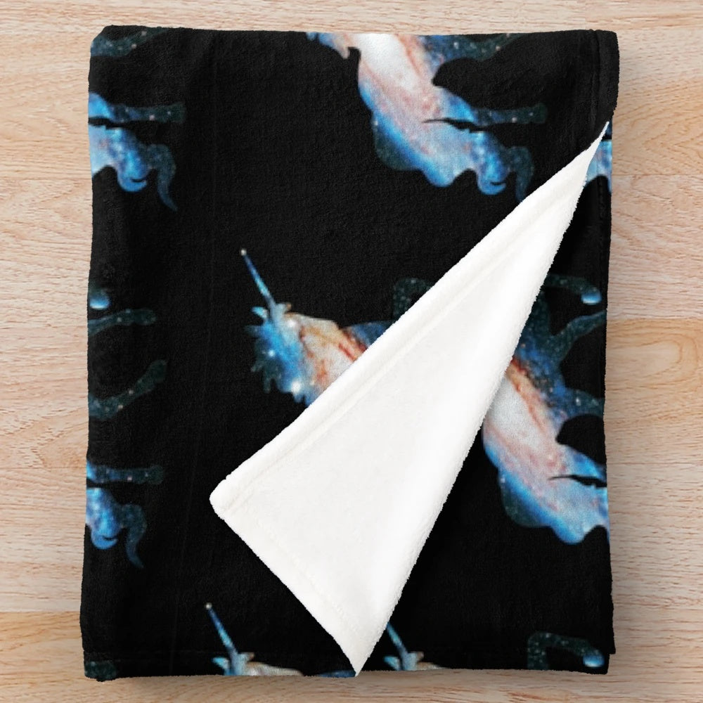 Soft, plush blanket featuring a magical unicorn silhouette against a starry galaxy background