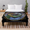 Soft and cozy plush blanket featuring a nature-inspired wheel of the year design