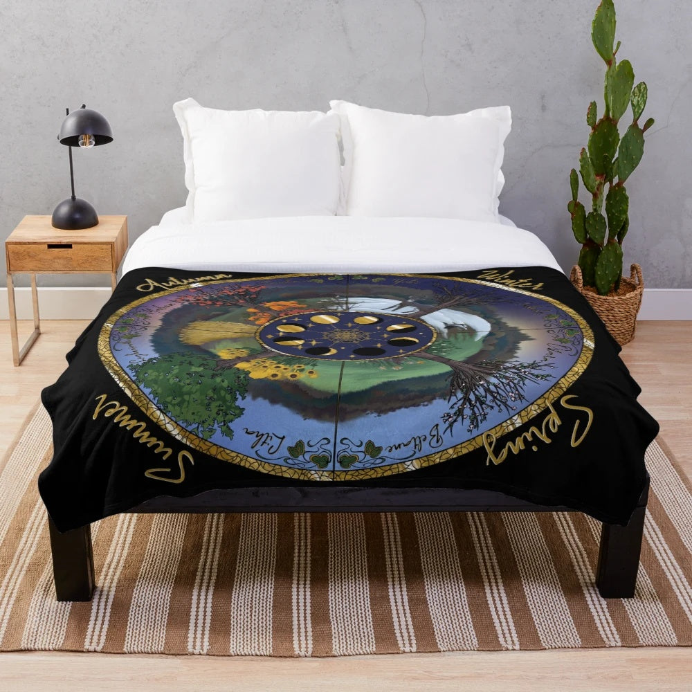 Soft and cozy plush blanket featuring a nature-inspired wheel of the year design