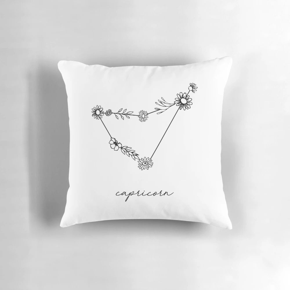 Decorative throw pillow featuring a wildflower constellation design in zodiac star sign colors