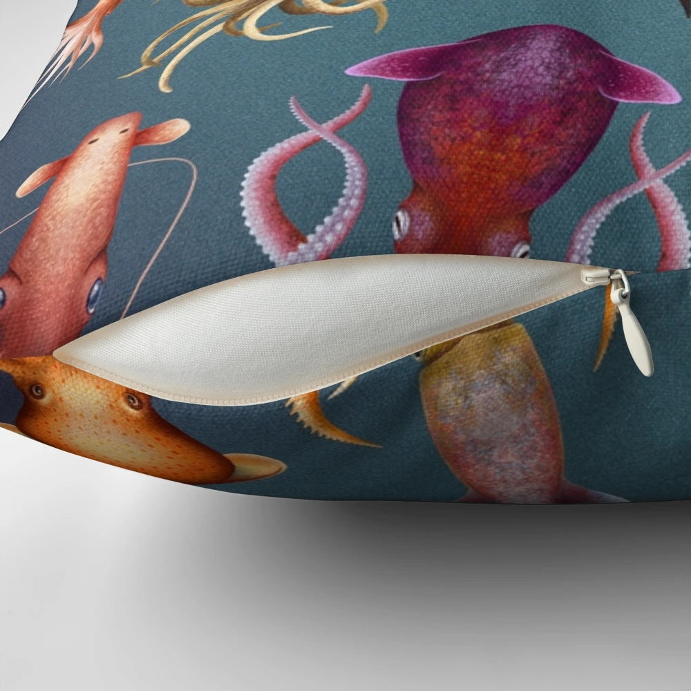 Decorative pillow featuring a cephalopod-inspired design, including squid, octopus, ammonite, and nautilus elements.