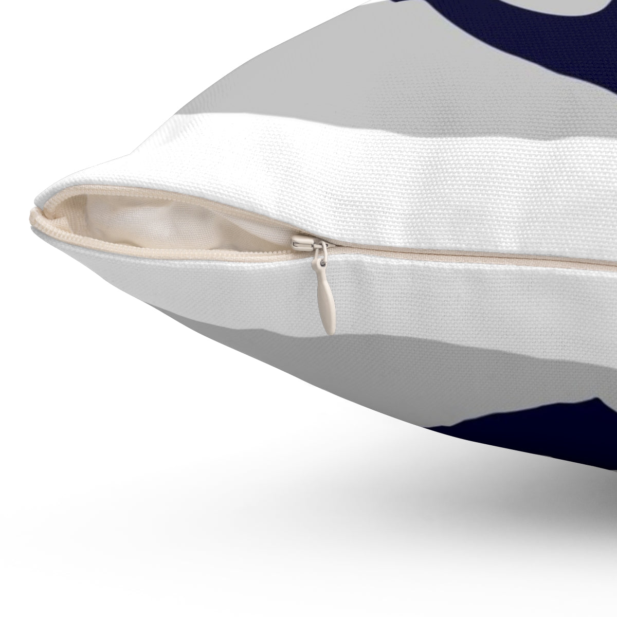 Navy blue and gray striped pillow with an anchor design, perfect for coastal decor - Detail