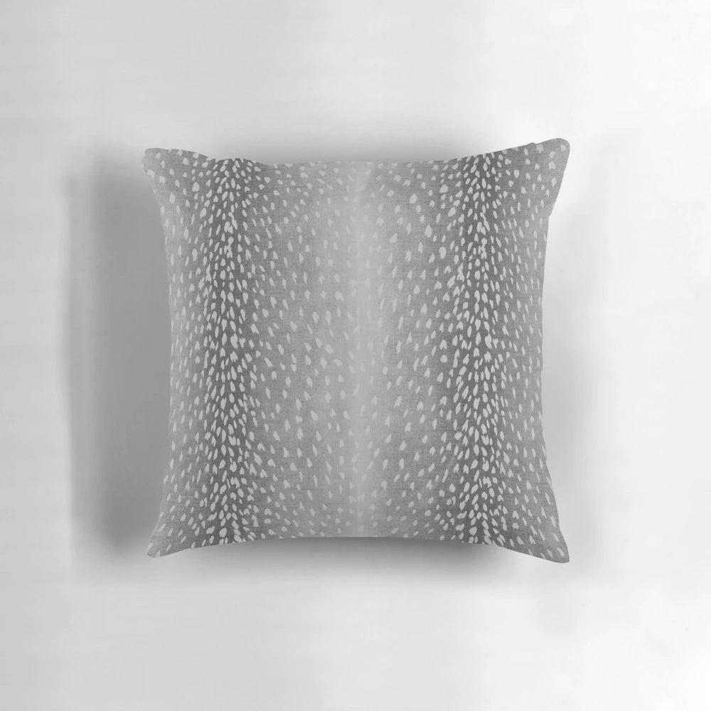 Charcoal grey throw pillow with fawn and antelope print pattern