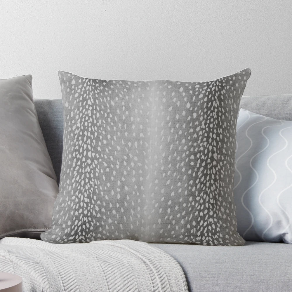 Charcoal grey throw pillow with fawn and antelope print pattern