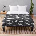 Charcoal grey plush blanket with a shark frenzy pattern design