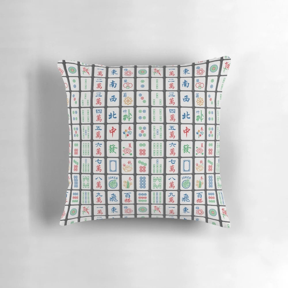Charcoal-colored decorative throw pillow featuring a pattern of traditional mahjong tiles