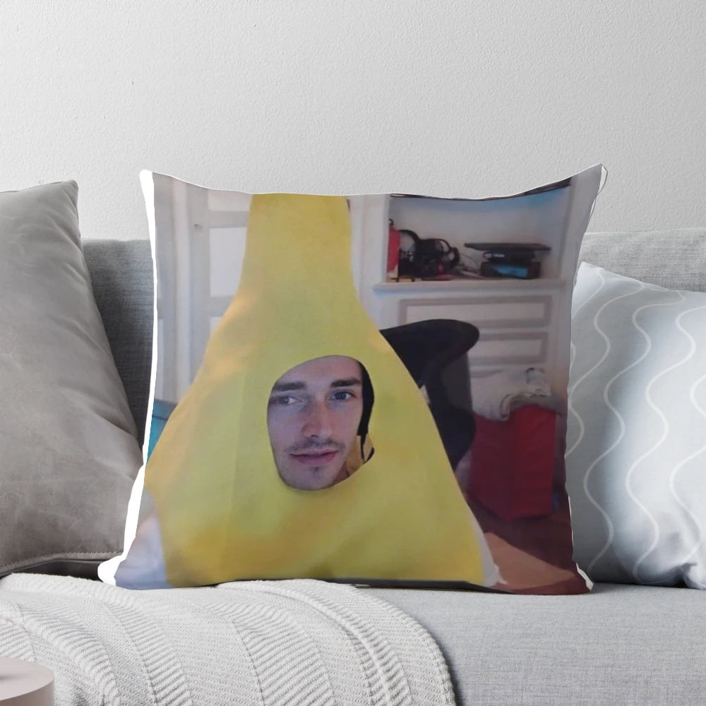 A plush pillow featuring a smiling Charles Leclerc, the Ferrari Formula 1 driver, holding a banana.