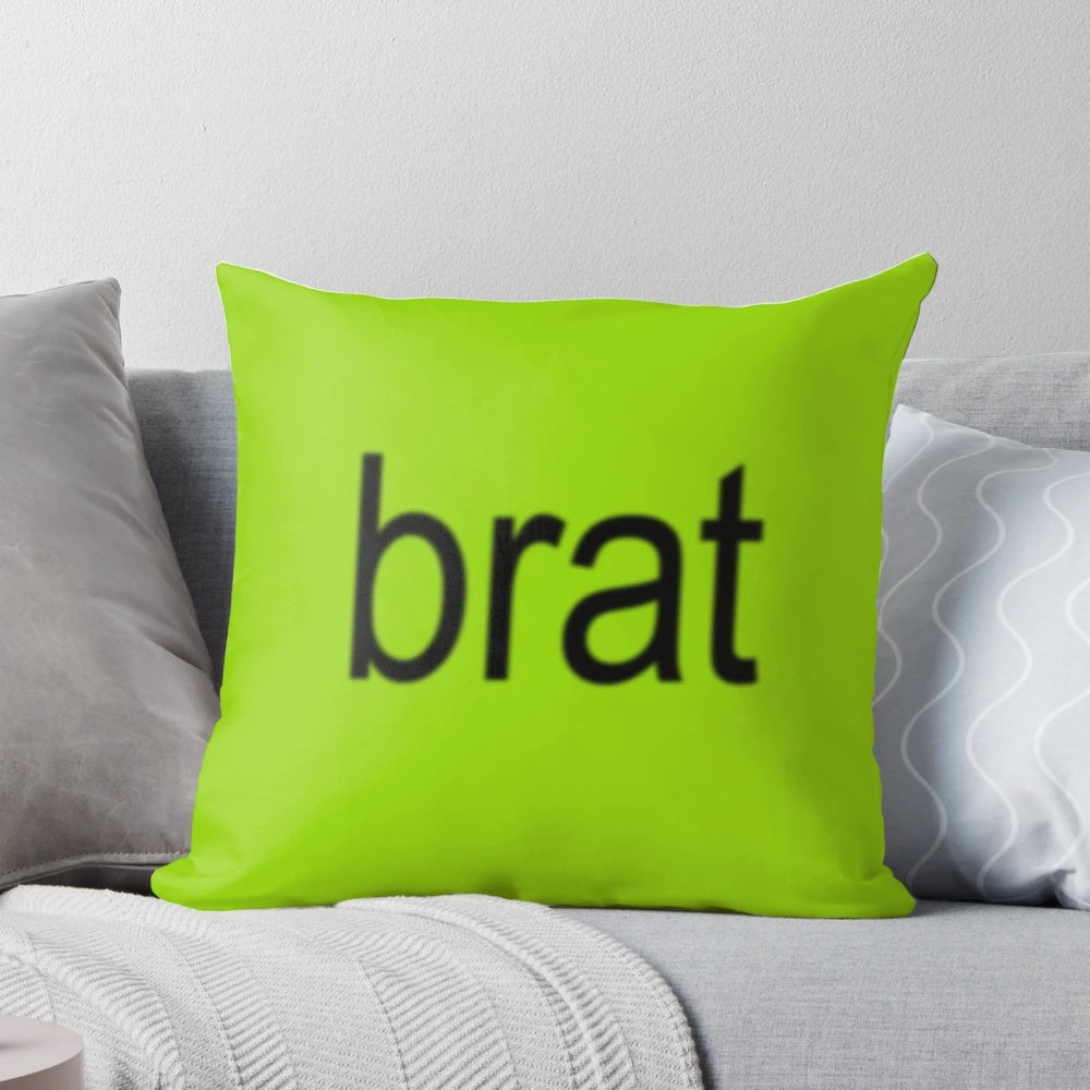 Charli XCX "Brat" album cover art printed on a plush, decorative pillow.