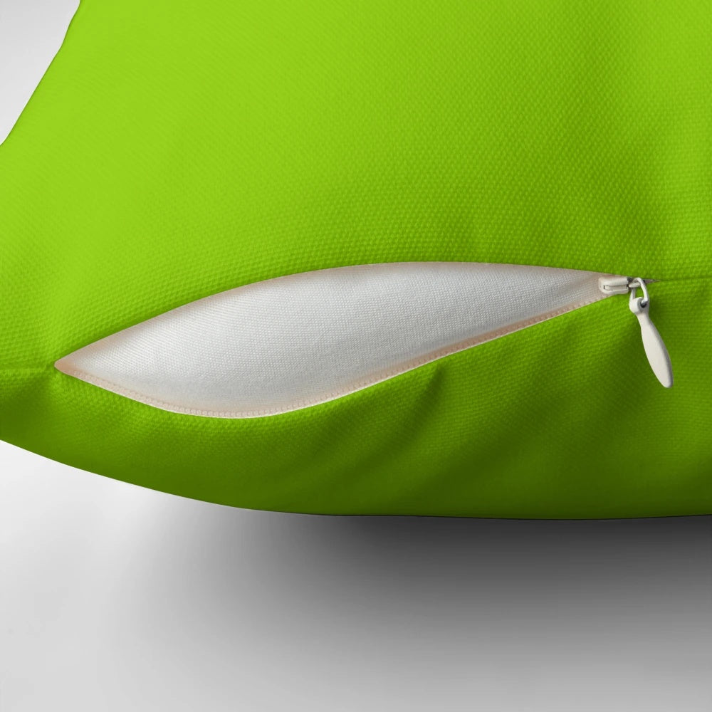 Charli XCX "Brat" album cover art printed on a plush, decorative pillow.