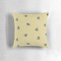 Decorative throw pillow with a vibrant bee and honeycomb pattern design