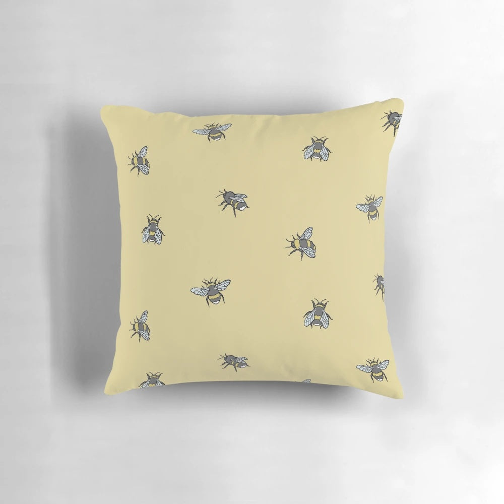 Decorative throw pillow with a vibrant bee and honeycomb pattern design