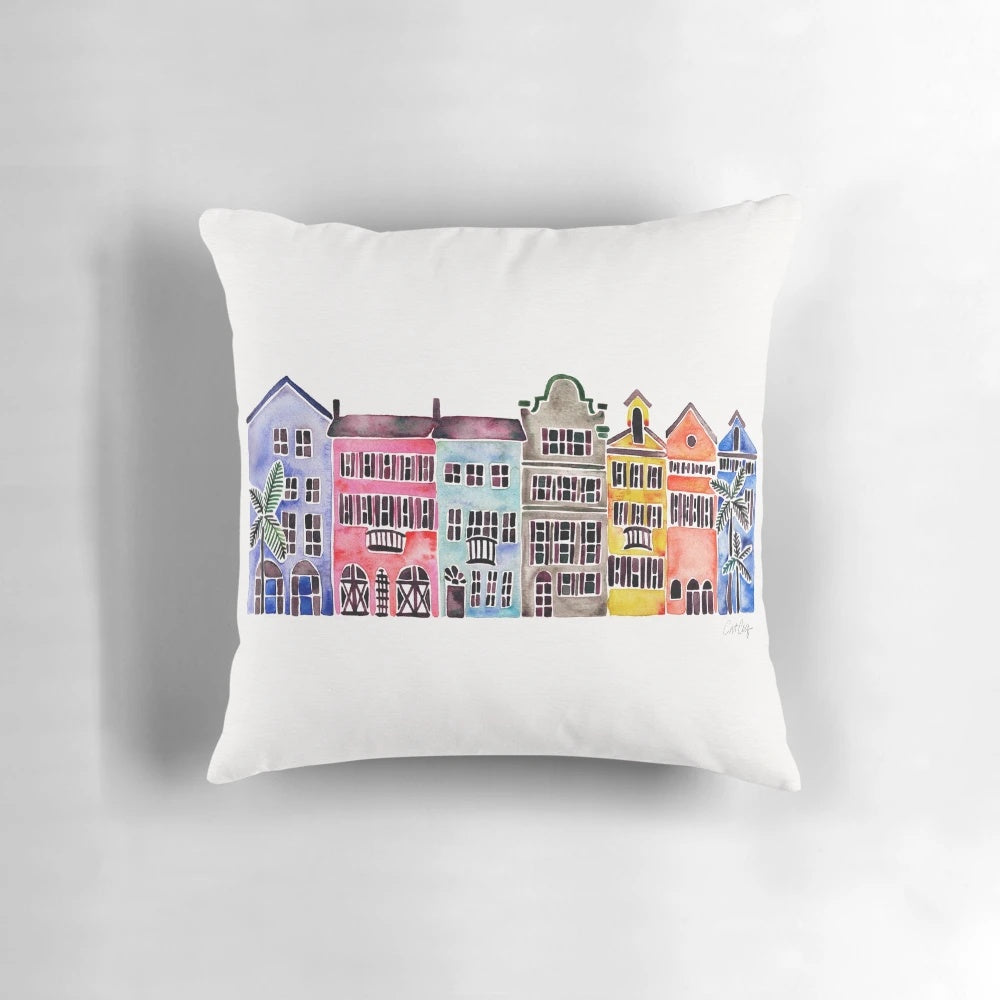 Vibrant watercolor illustration of iconic Charleston, South Carolina homes on Rainbow Row with palm trees.