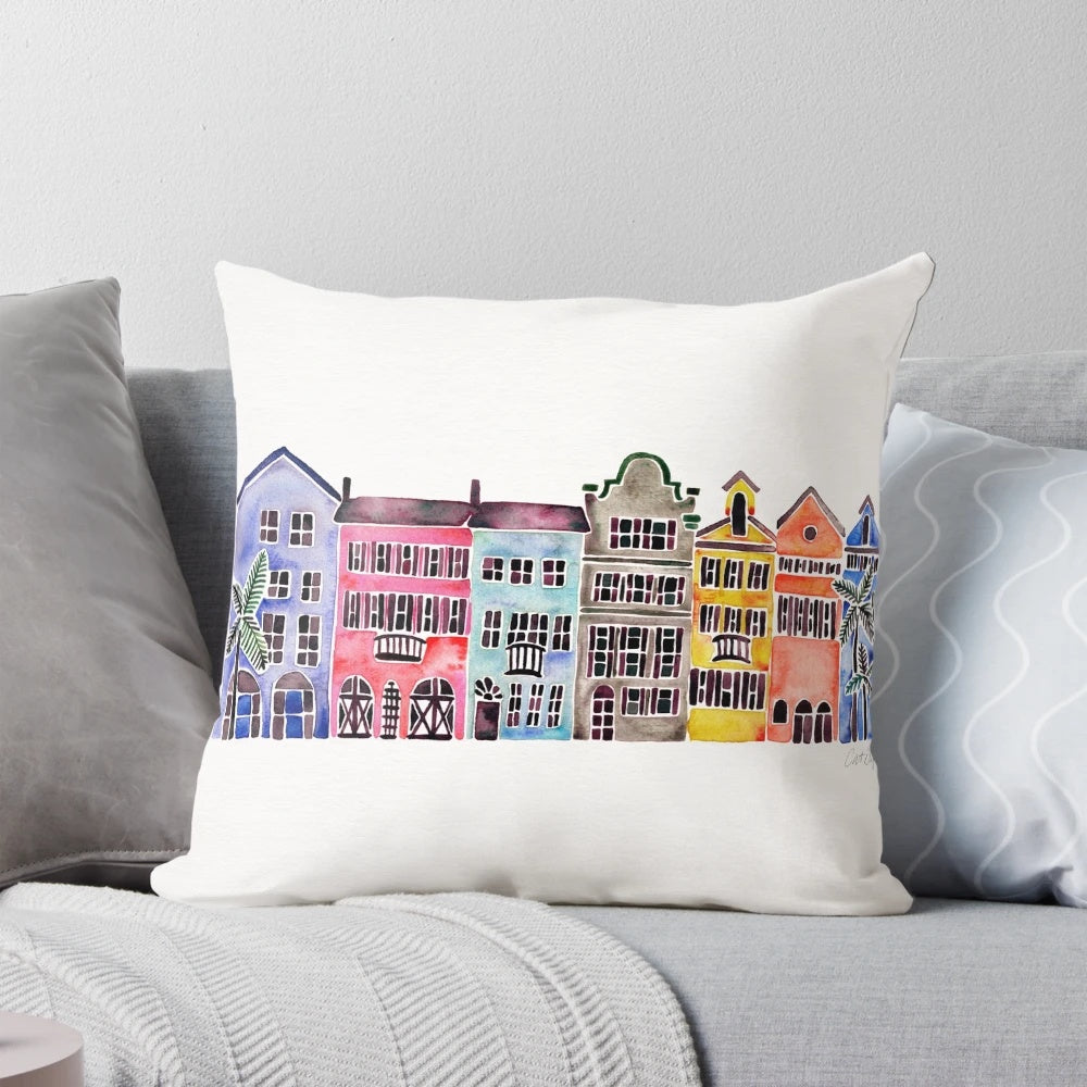 Vibrant watercolor illustration of iconic Charleston, South Carolina homes on Rainbow Row with palm trees.