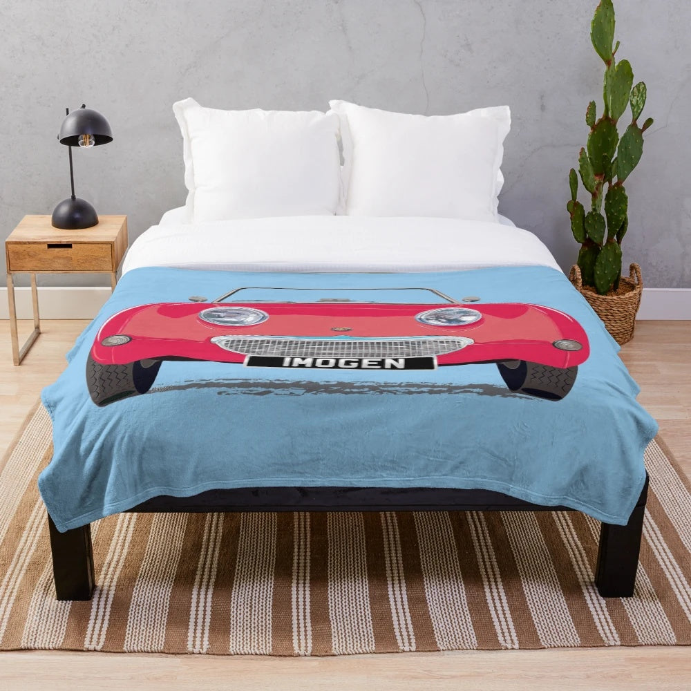 Cherry red plush blanket featuring a frog-eye/bug-eye design inspired by the Austin Healey Sprite