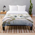 Soft and cozy chickadee plush blanket with nature-inspired design