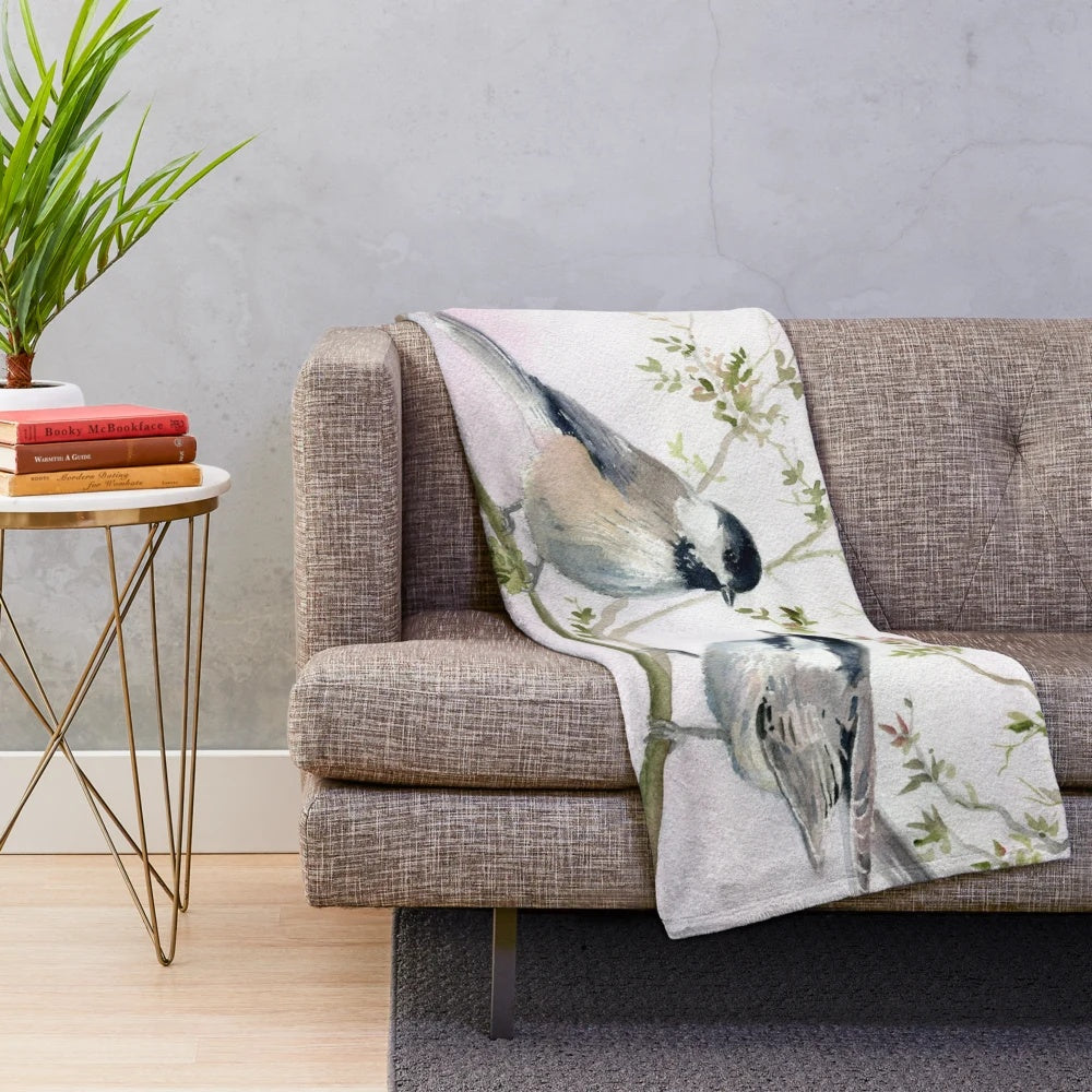 Soft and cozy chickadee plush blanket with nature-inspired design