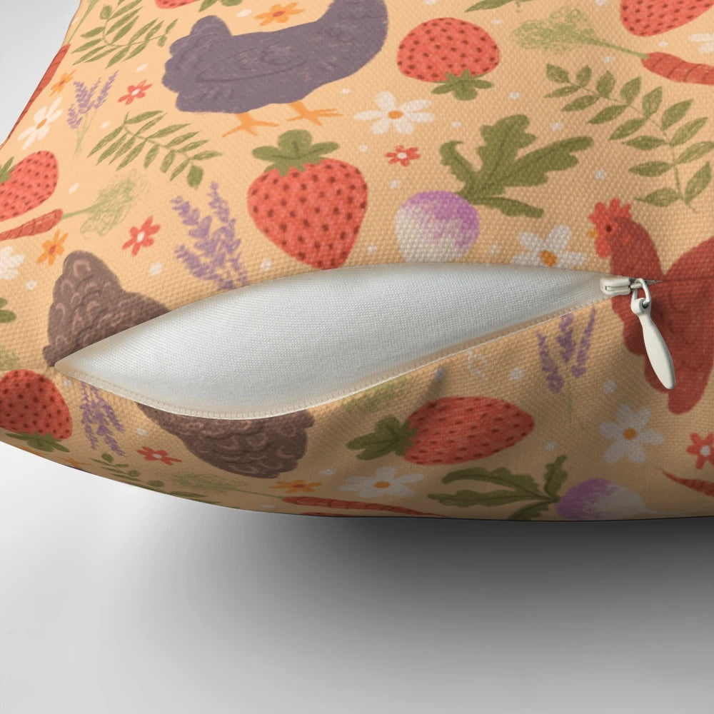 A decorative throw pillow featuring a whimsical pattern of chickens, strawberries, carrots, lavender, and turnips - perfect for a cozy, nature-inspired home.