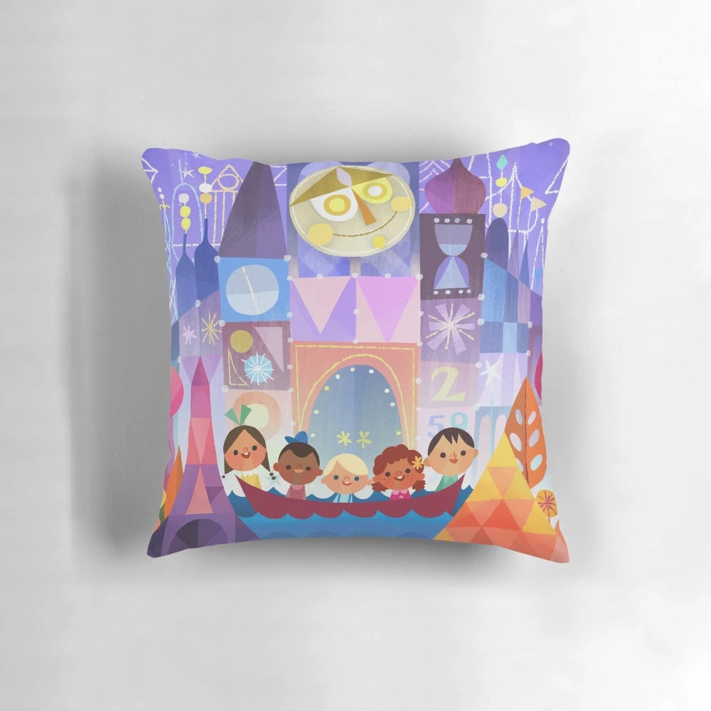 A small, decorative pillow featuring a "its a small world" theme, perfect for Disney fans and world travelers.
