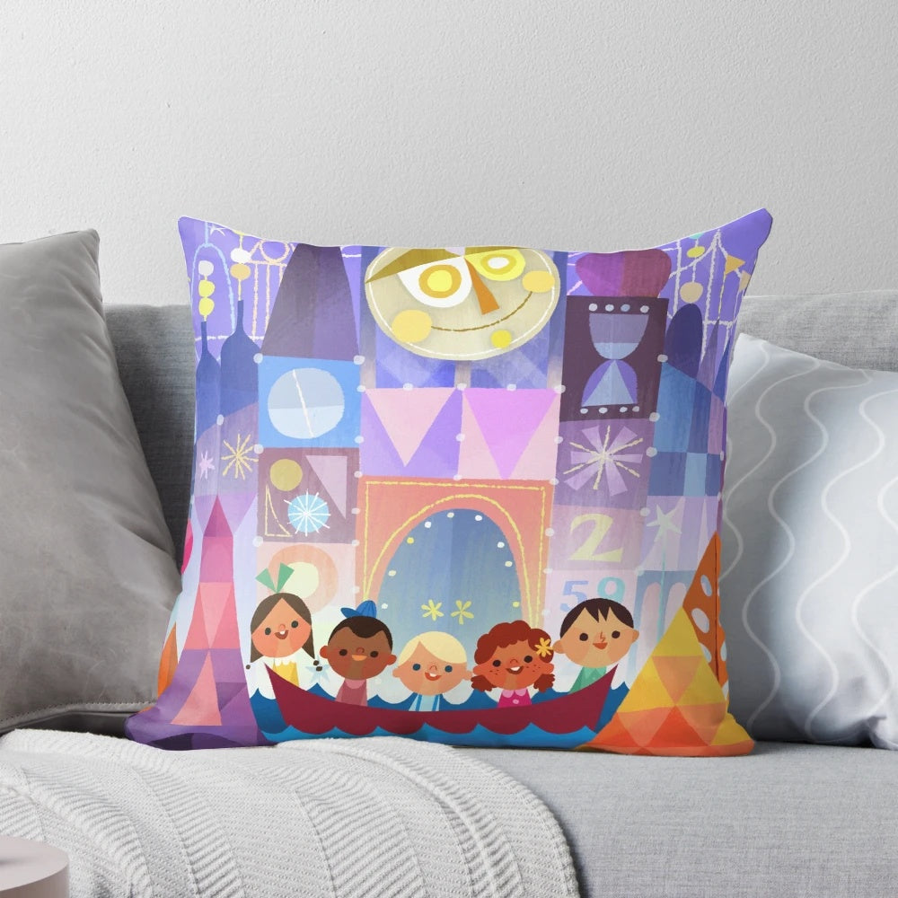 A small, decorative pillow featuring a "its a small world" theme, perfect for Disney fans and world travelers.