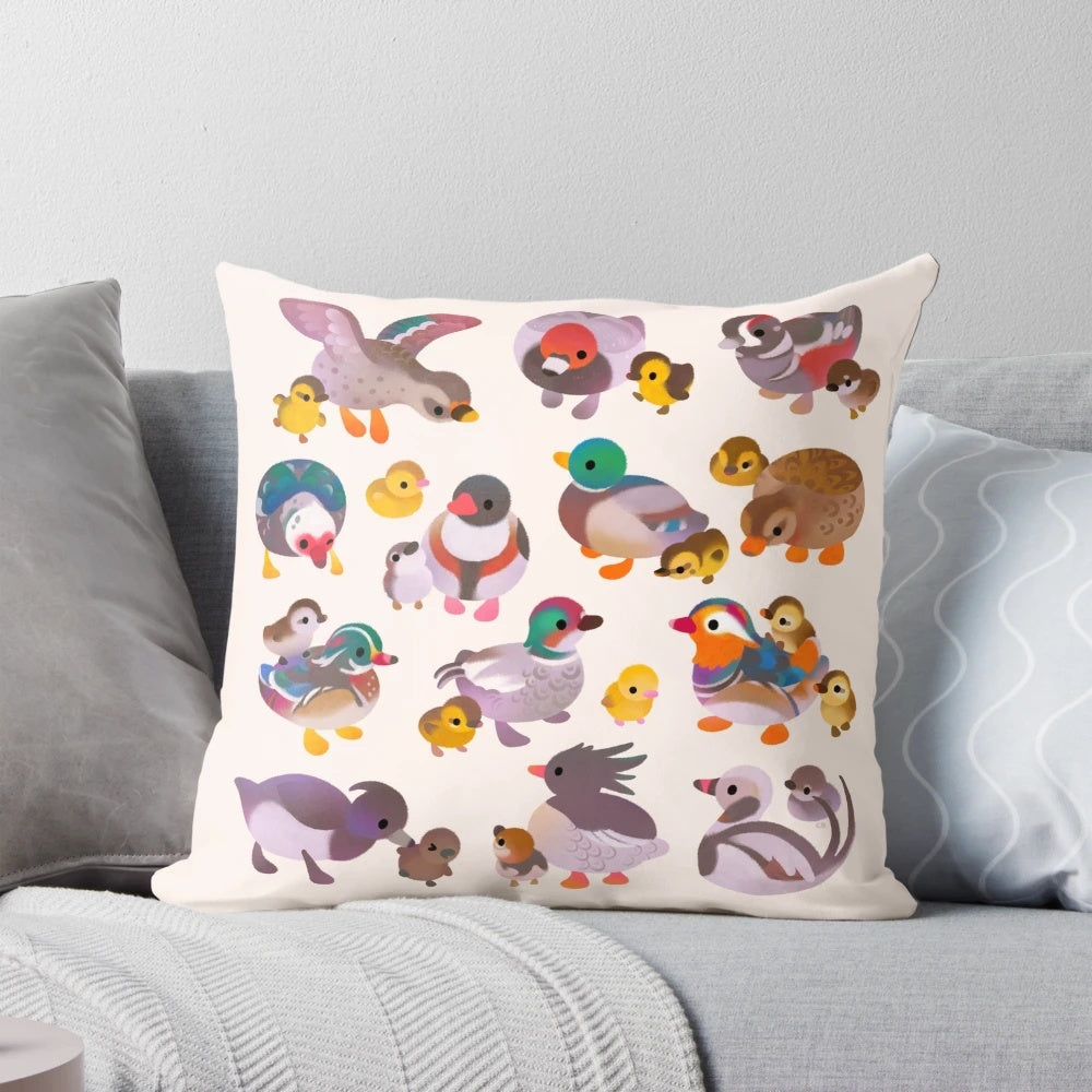 Decorative pillow featuring a hand-drawn illustration of a duck and her duckling on a wooden background.