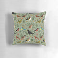 A decorative pillow featuring a colorful pattern of British garden birds such as sparrows, blackbirds, robins, and finches.