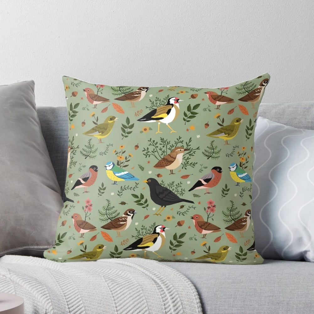 A decorative pillow featuring a colorful pattern of British garden birds such as sparrows, blackbirds, robins, and finches.