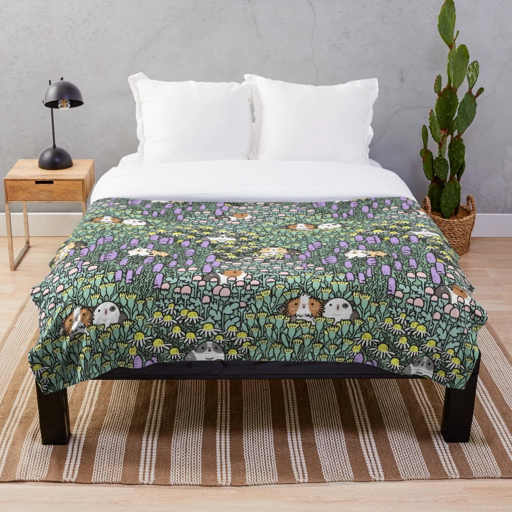 Cozy plush blanket with a whimsical guinea pig and herb garden design
