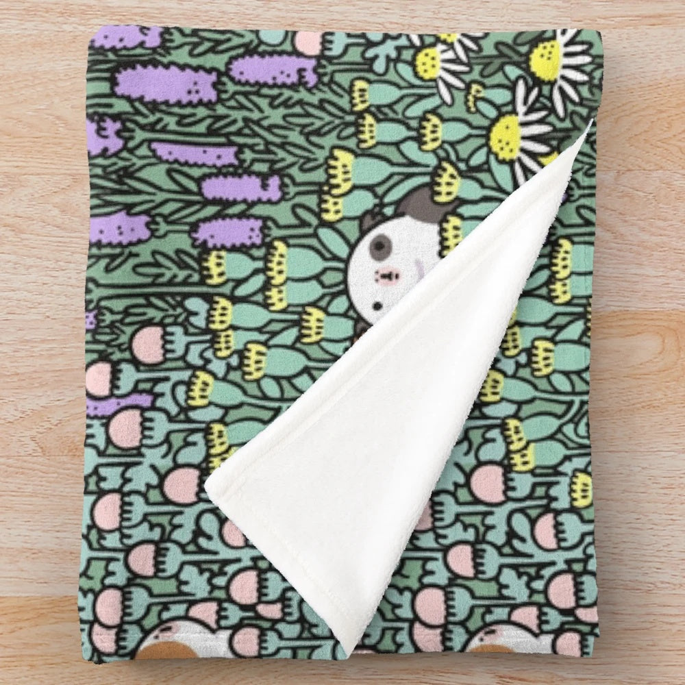 Cozy plush blanket with a whimsical guinea pig and herb garden design