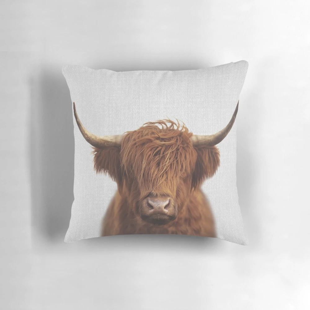 Colorful highland cow decorative pillow with a whimsical, minimalist design