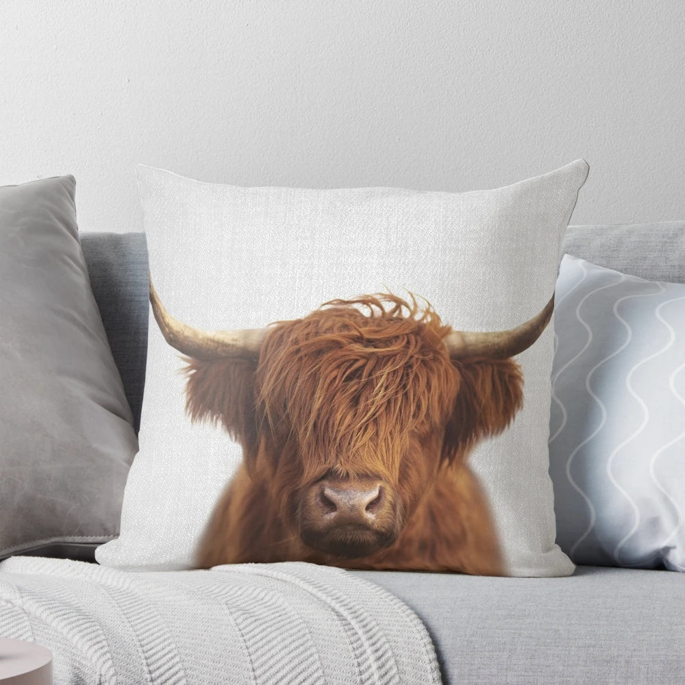 Colorful highland cow decorative pillow with a whimsical, minimalist design