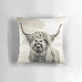 Cheeky highland cow printed on a modern, decorative throw pillow
