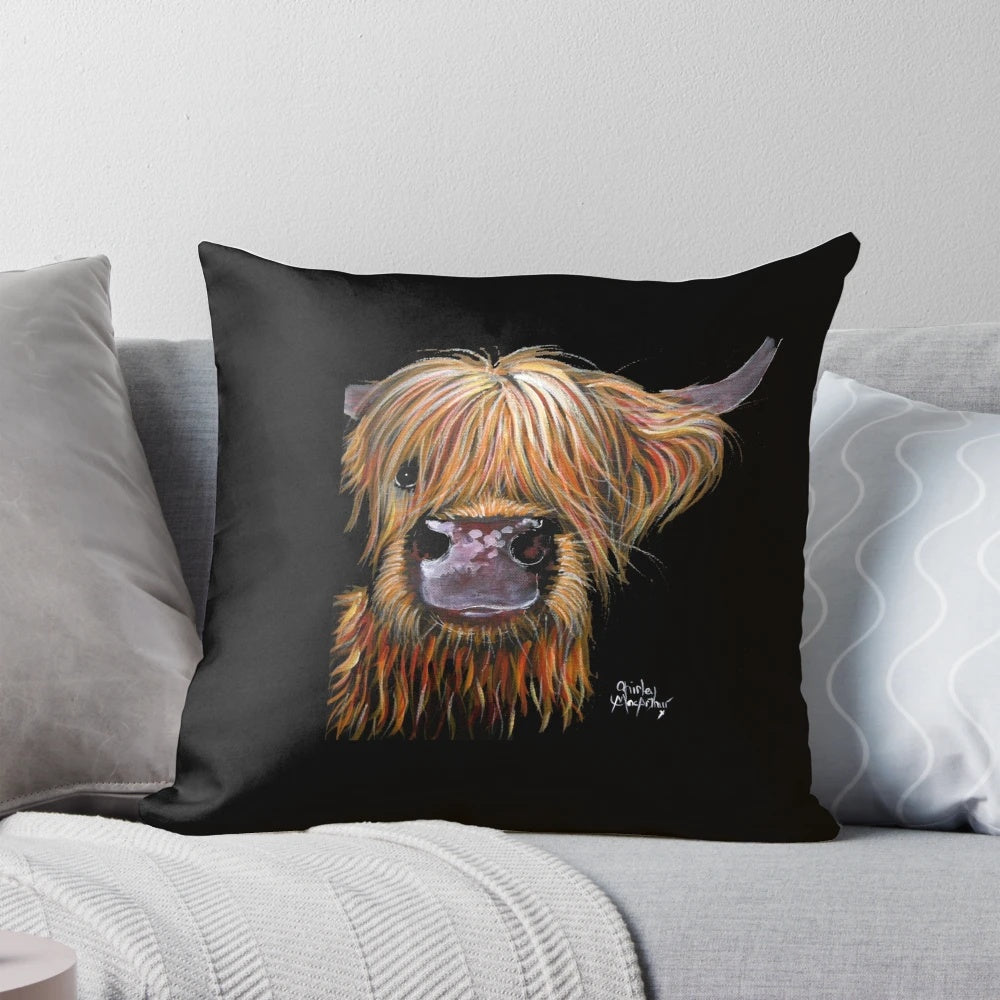 A plush pillow featuring a whimsical highland cow design