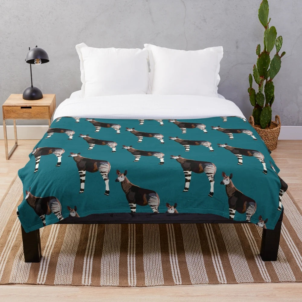 Okapi plush blanket featuring a detailed illustration of the unique and endangered okapi animal