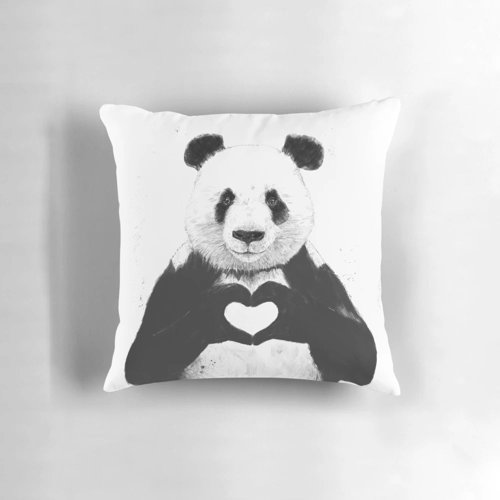 Charming panda pillow with a whimsical black and white design featuring a heart and graffiti-inspired illustration