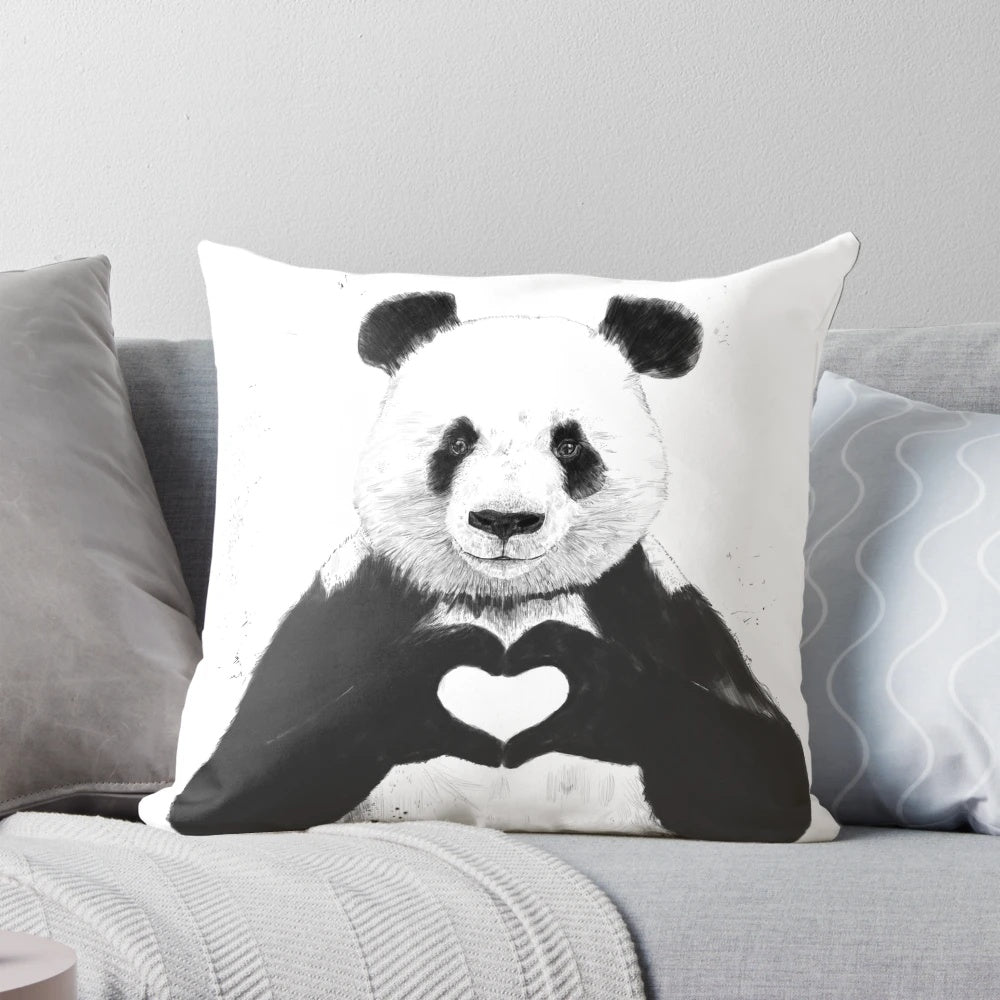 Charming panda pillow with a whimsical black and white design featuring a heart and graffiti-inspired illustration