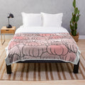 Soft, hand-drawn pink pumpkin plush blanket for a cozy, fall aesthetic