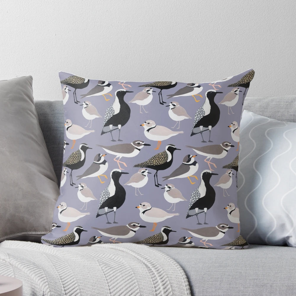 Colorful pillow featuring a design of adorable plovers on a sandy beach