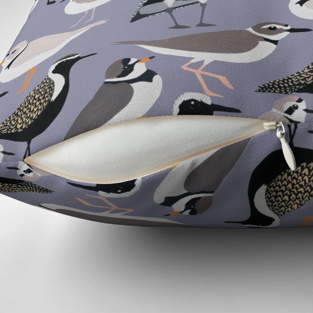 Colorful pillow featuring a design of adorable plovers on a sandy beach
