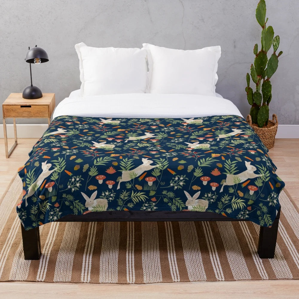 Plush blanket with a happy rabbit pattern in a botanical, nature-inspired design