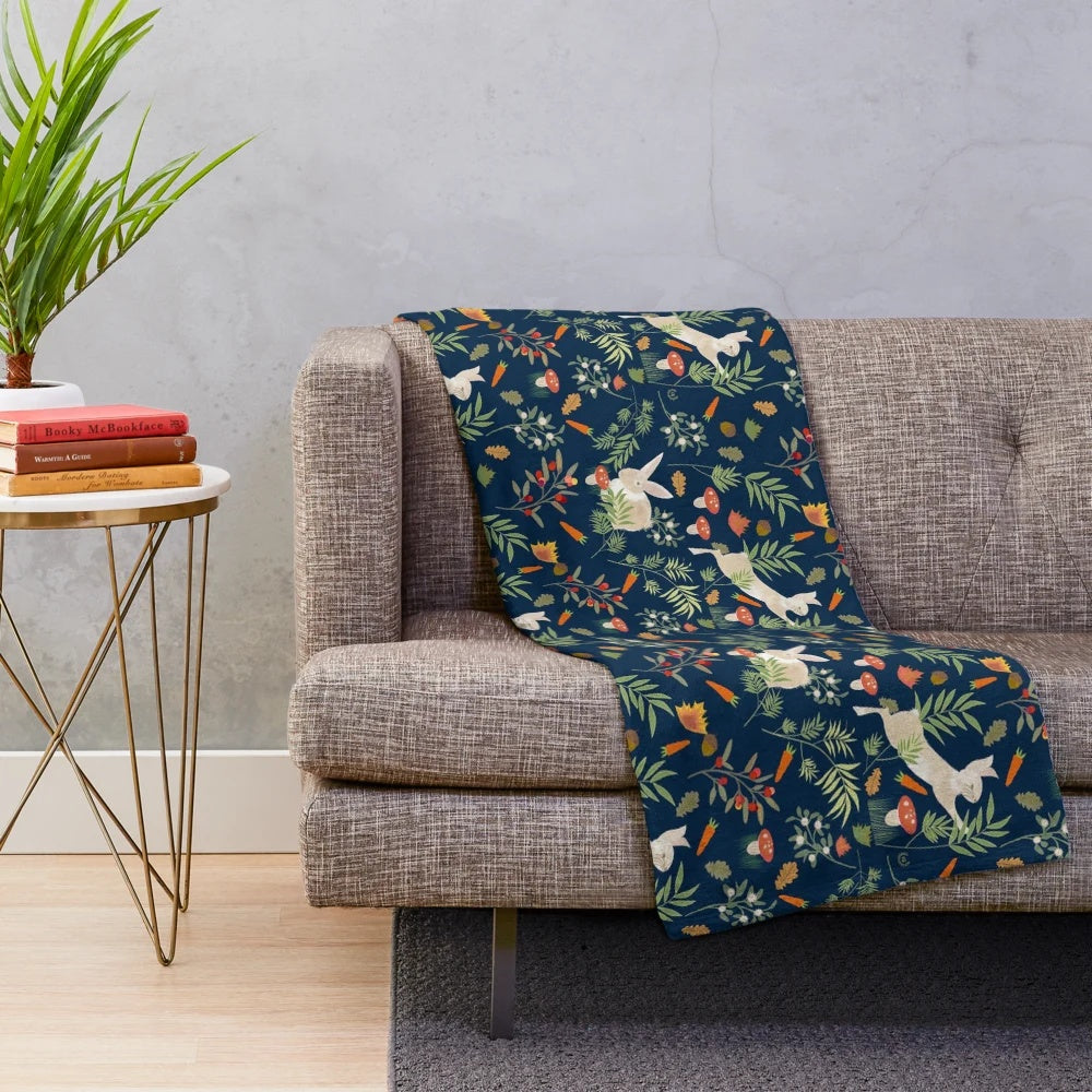 Plush blanket with a happy rabbit pattern in a botanical, nature-inspired design