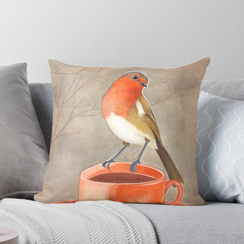 A watercolor illustration of a robin bird perched on a coffee mug, creating a cozy and whimsical coffee-themed pillow design.