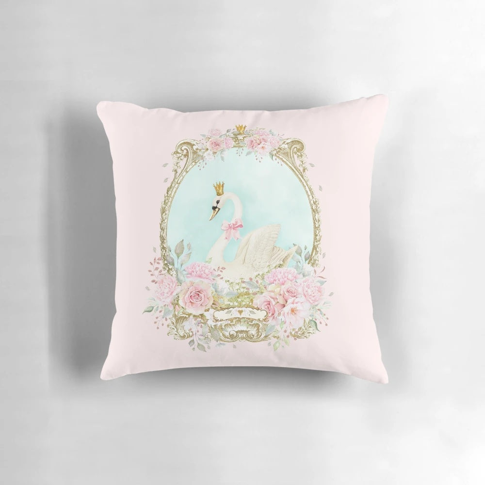 A shabby chic pillow featuring a delicate watercolor-style white swan with a gold crown and pink flowers.