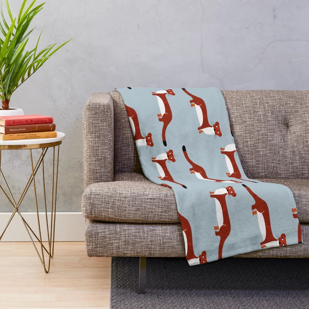 Soft and cozy weasel plush blanket with a quirky and endearing design
