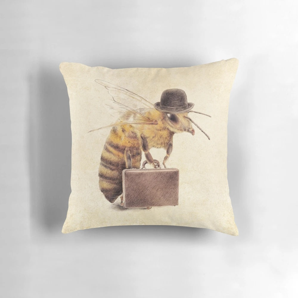 A decorative pillow featuring a worker bee dressed in business attire with a briefcase.