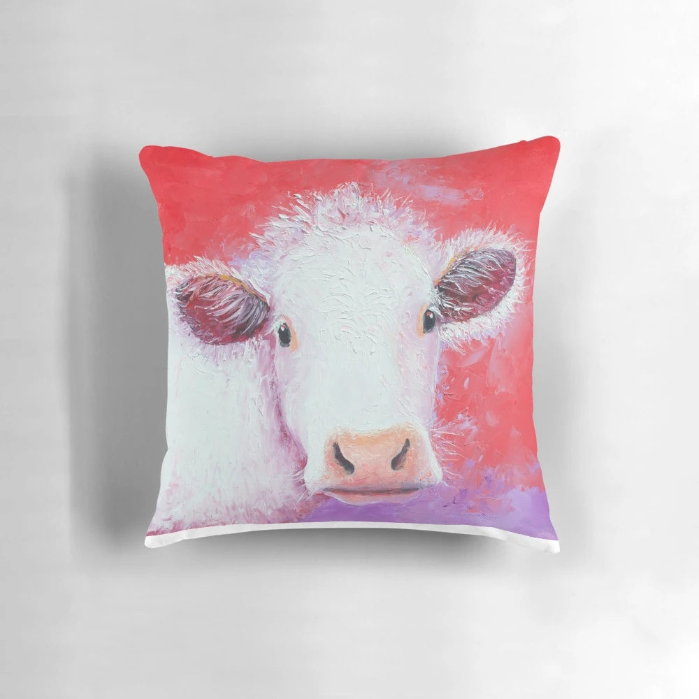 White Charolais cow painting on a red background, featured on a decorative throw pillow for the kitchen, living room, or bedroom.