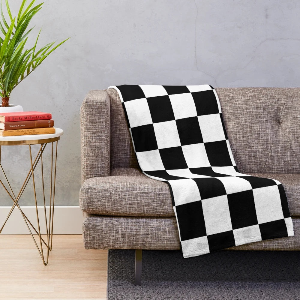Soft, cozy plush blanket featuring a checkered flag design for racing car lovers