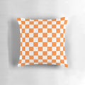 Checkered orange and white square pillow for modern and abstract home decor