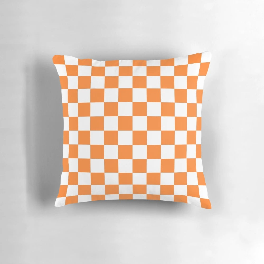 Checkered orange and white square pillow for modern and abstract home decor