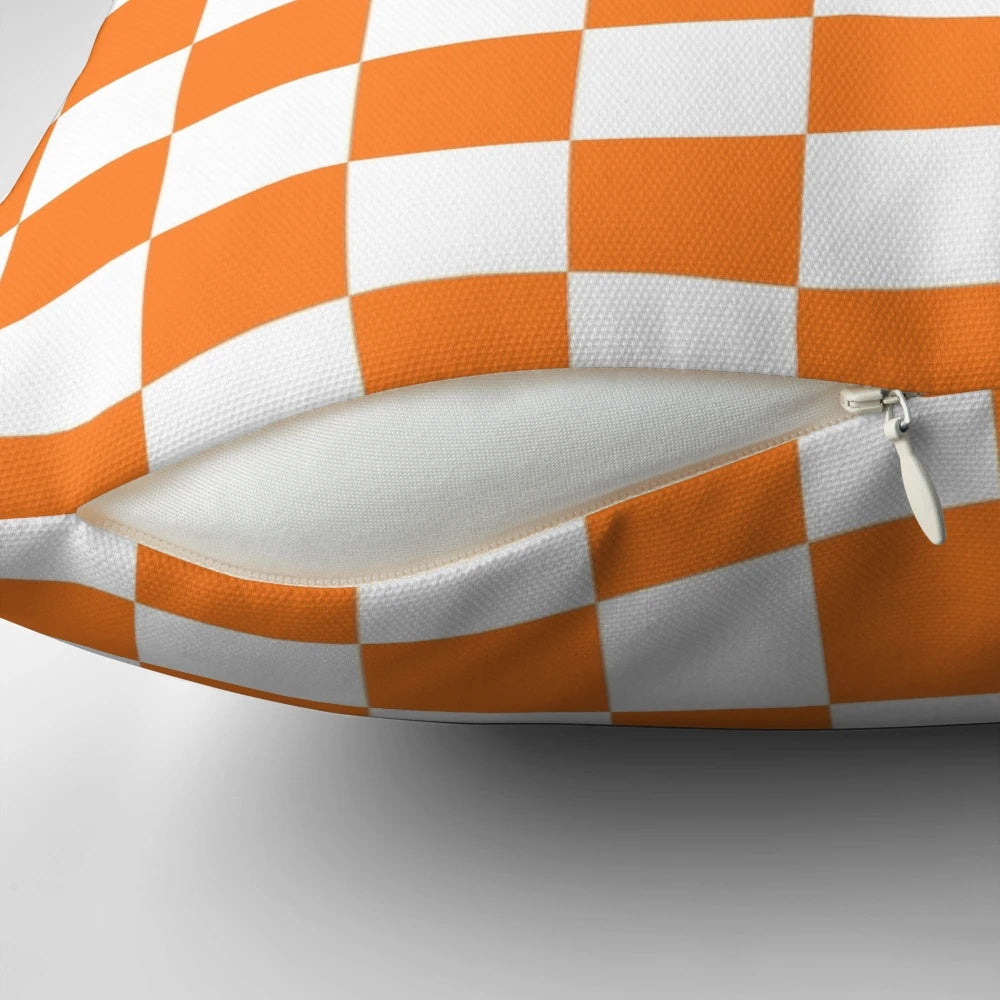 Checkered orange and white square pillow for modern and abstract home decor
