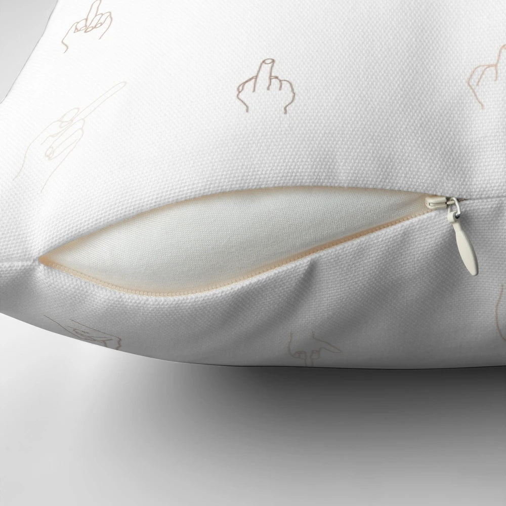 An artistic black and white line drawing of a hand with the middle finger raised on a white throw pillow